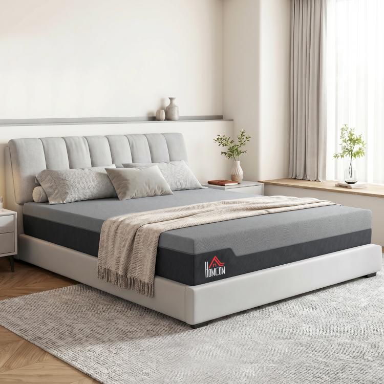 King-size memory foam mattress on a platform bed with gray cover and headboard