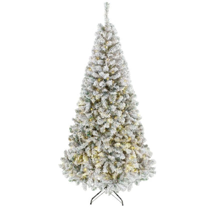 Snow-flocked prelit Christmas tree, slim conical shape, white needles with warm lights.