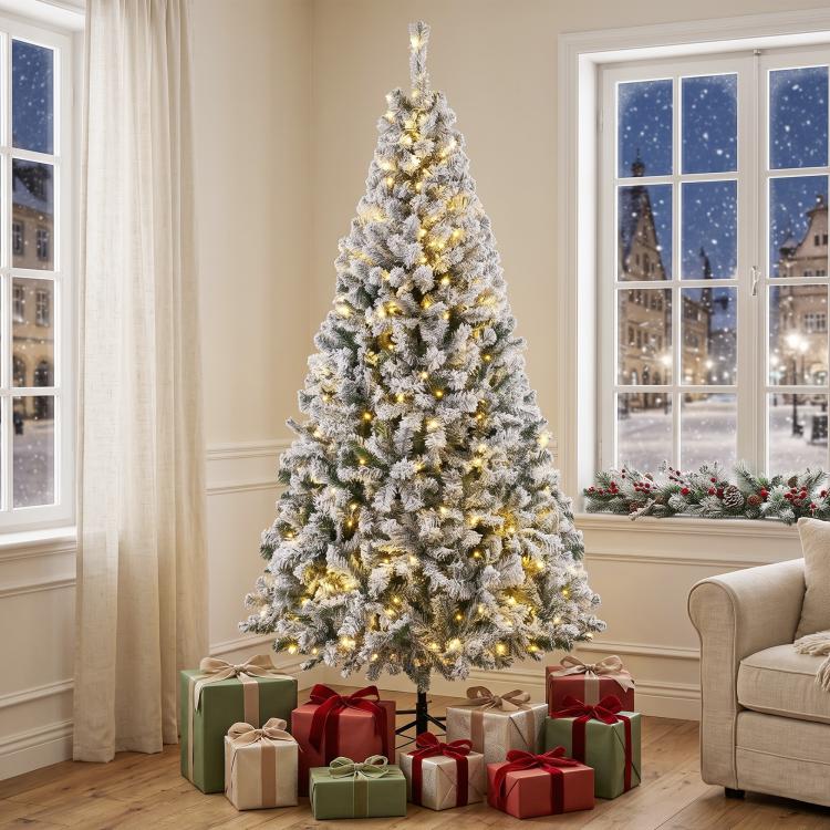 7.5 ft flocked prelit Christmas tree with warm white lights and hinged branches