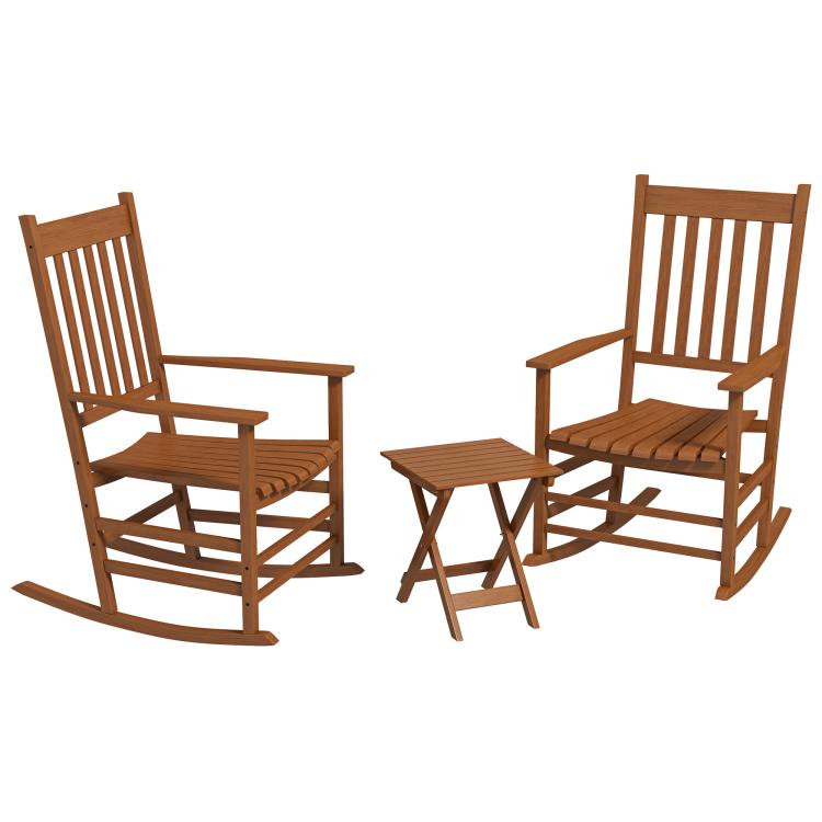 Pair of brown slatted wooden rocking chairs with matching side table on the patio