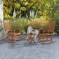 Outdoor rocking chair set of 2 with side table and slatted seats in warm wood tone