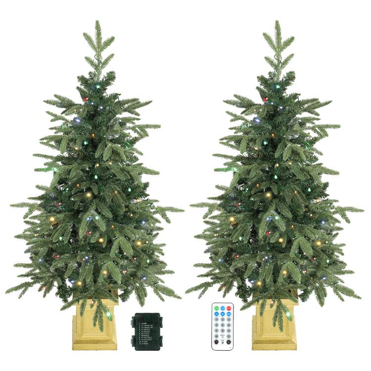 Set of 2 prelit artificial Christmas trees with dual-color lights and golden bases.