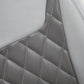 Gray upholstered recliner panel with diamond quilting and contrast-stitched seams