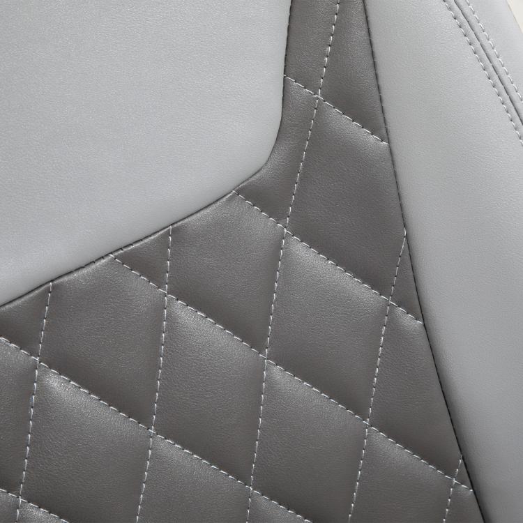 Gray upholstered recliner panel with diamond quilting and contrast-stitched seams