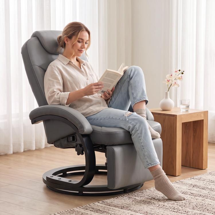 Gray manual recliner chair with extended footrest and swivel base, quilted back.