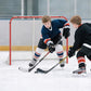 Hockey goal with red frame and white net during street hockey practice
