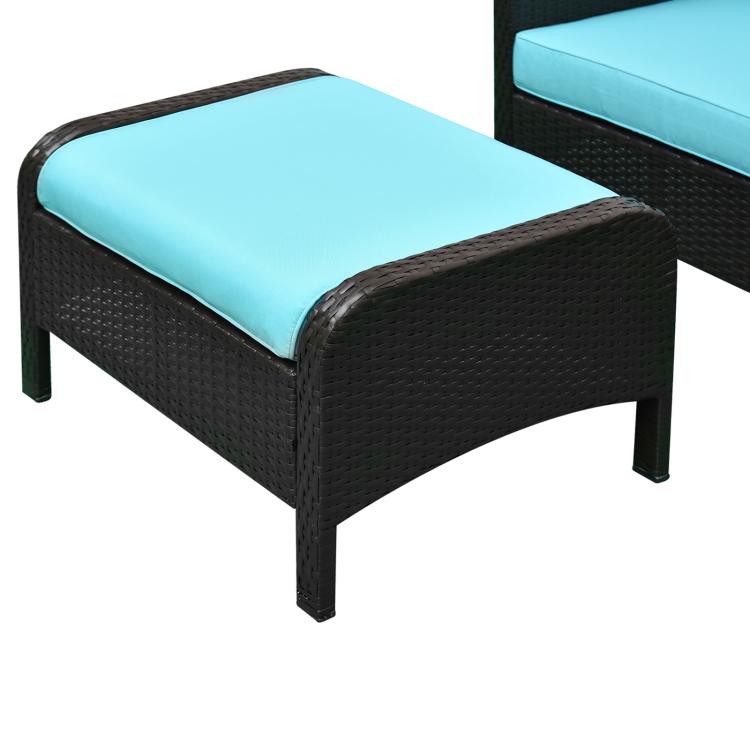 Wicker lounge chair with turquoise cushion, dark wicker frame, rounded arms