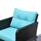 Close-up of teal cushion with tufted buttons on dark woven wicker lounge chair