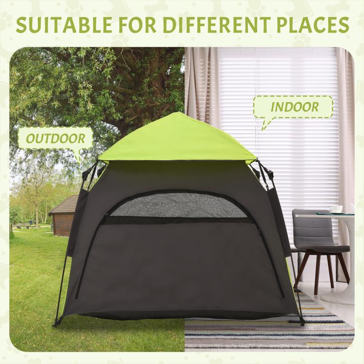 Green and black dog tent shown for indoor and outdoor placement