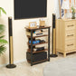 Brown 4-tier media stand beside wall TV with open shelves and black frame
