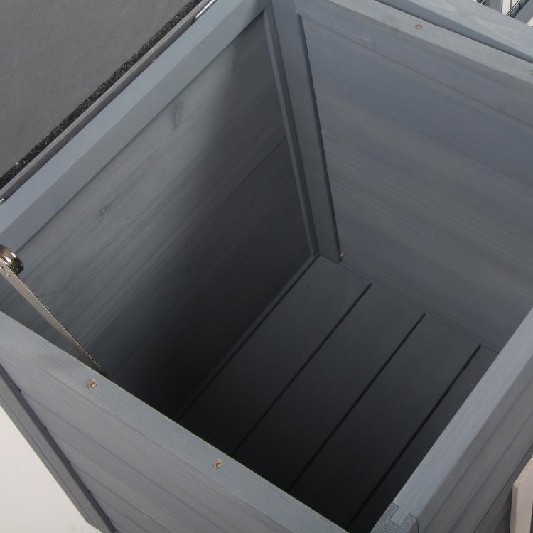 Gray interior base and smooth floor panels inside rabbit hutch