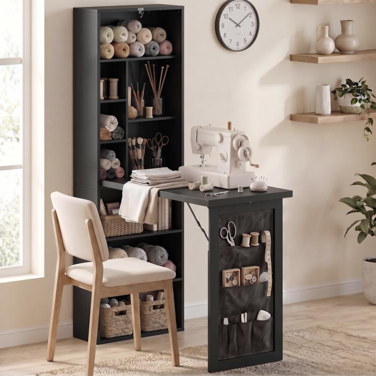 Black foldable writing and craft table with open storage shelves and side hanging pockets