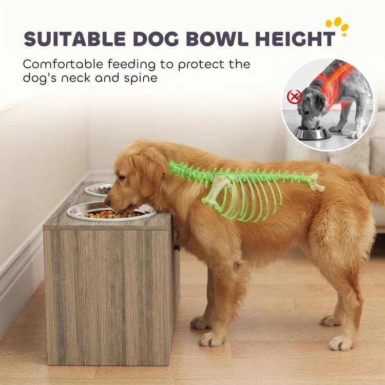 Wood-grain elevated dog feeding station with two stainless bowls beside a dog