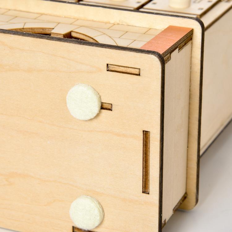 Wooden light-up Christmas advent calendar with numbered drawer slots and round controls