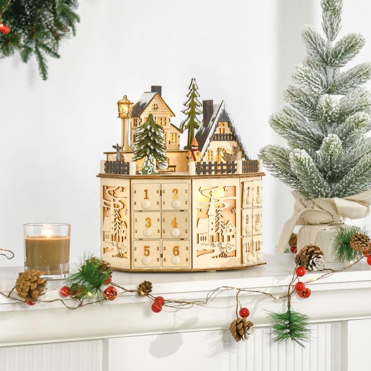 Wooden light-up Christmas advent calendar on a tabletop with 12 numbered drawers