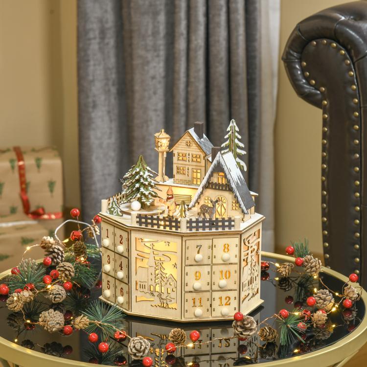 Wooden light-up Christmas advent calendar with decorated village houses and numbered drawers