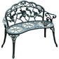 Green metal bench with arched back scrollwork and rose floral centerpiece