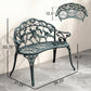 Green ornamental cast aluminum bench with rose backrest and decorative cutout seat