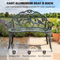 Green cast aluminum bench with curved back and rose rosette scroll design