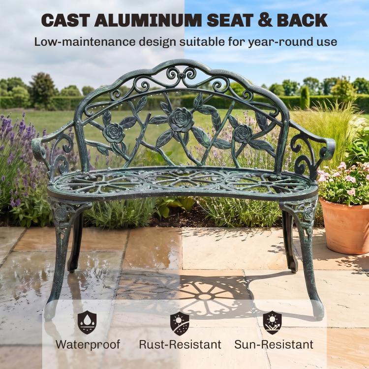 Green cast aluminum bench with curved back and rose rosette scroll design