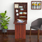 Wall-mounted mahogany desk with cubby shelves, paper on tabletop, laptop and decor