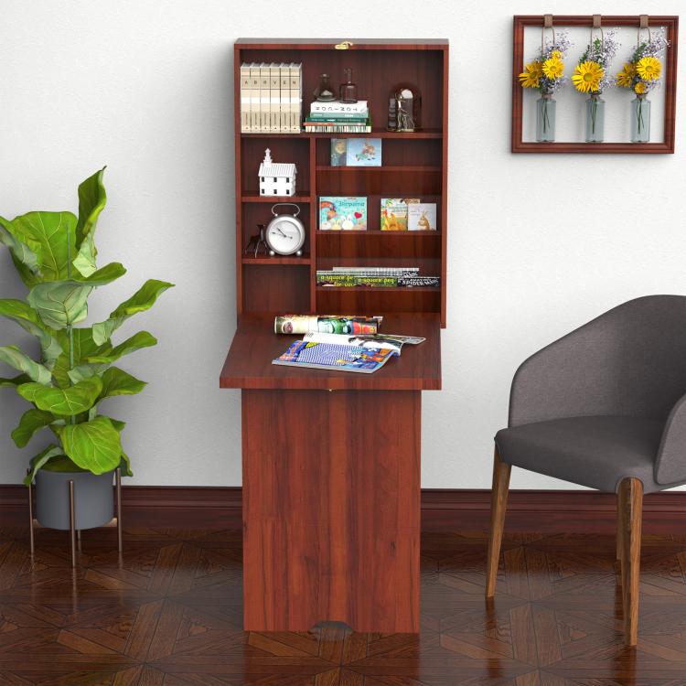 Wall-mounted mahogany desk with cubby shelves, paper on tabletop, laptop and decor