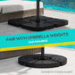 Black umbrella cross base with flat weight plates arranged around the pole