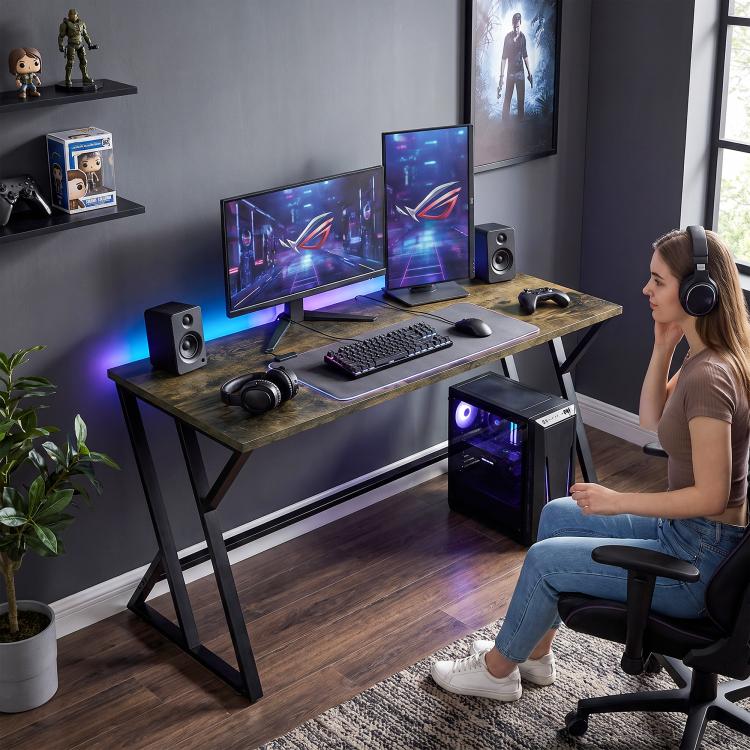 Rustic brown desk with black Z legs with dual monitors, keyboard, and headset