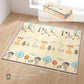 Forest animal reversible play mat laid flat on hardwood floor, beige and blue
