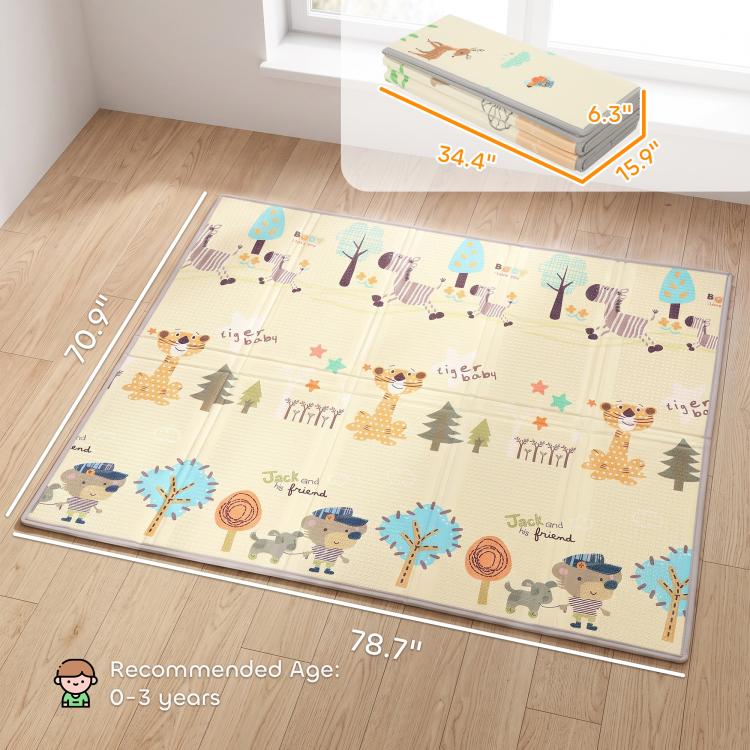Forest animal reversible play mat laid flat on hardwood floor, beige and blue