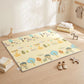 Reversible forest animal baby play mat on floor, beige with colorful wildlife illustrations