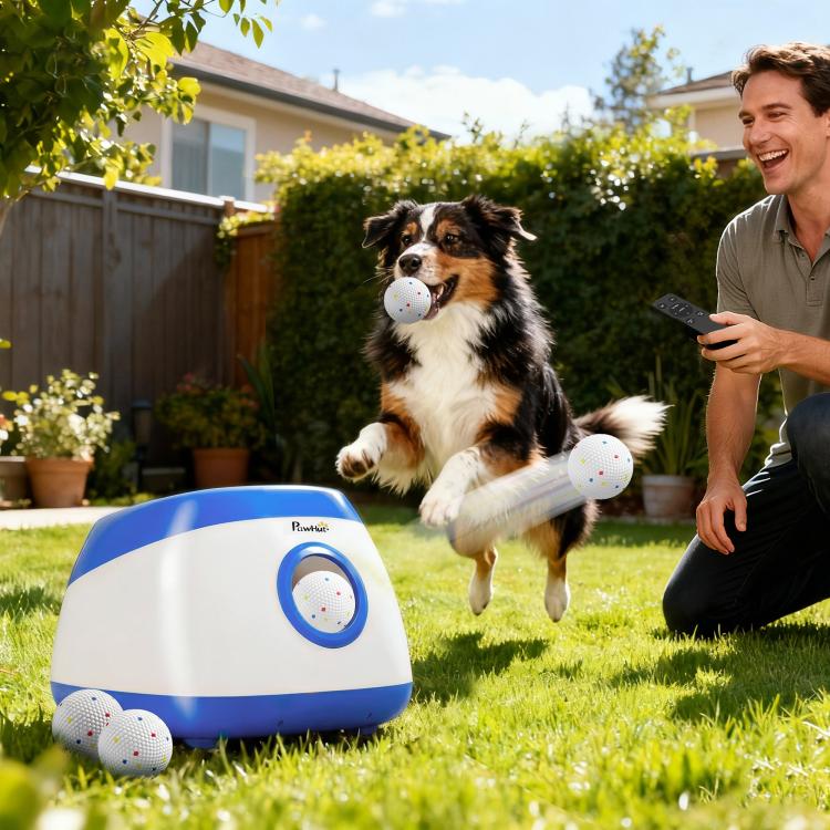 Blue and white dog ball launcher with ball, with a dog mid-jump nearby