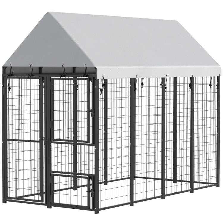 Outdoor dog kennel with roof and black wire mesh sides, showing side door panel
