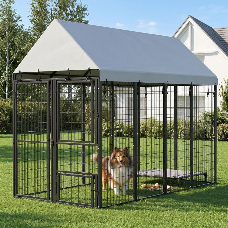 Outdoor dog kennel with roof, black wire panels, and front door gate