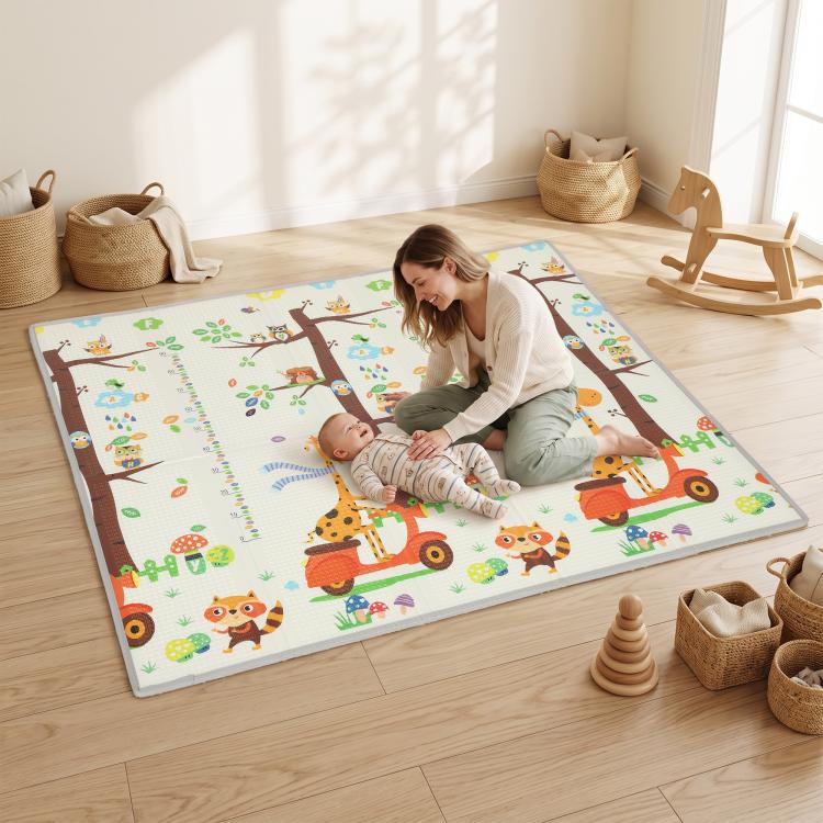 Reversible woodland animal play mat with giraffe, hedgehog, and owl illustrations on floor