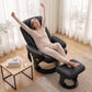 Black PU massage recliner chair with ottoman raised for full recline