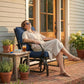 Outdoor glider chair with dark blue cushions and curved armrests on steel frame