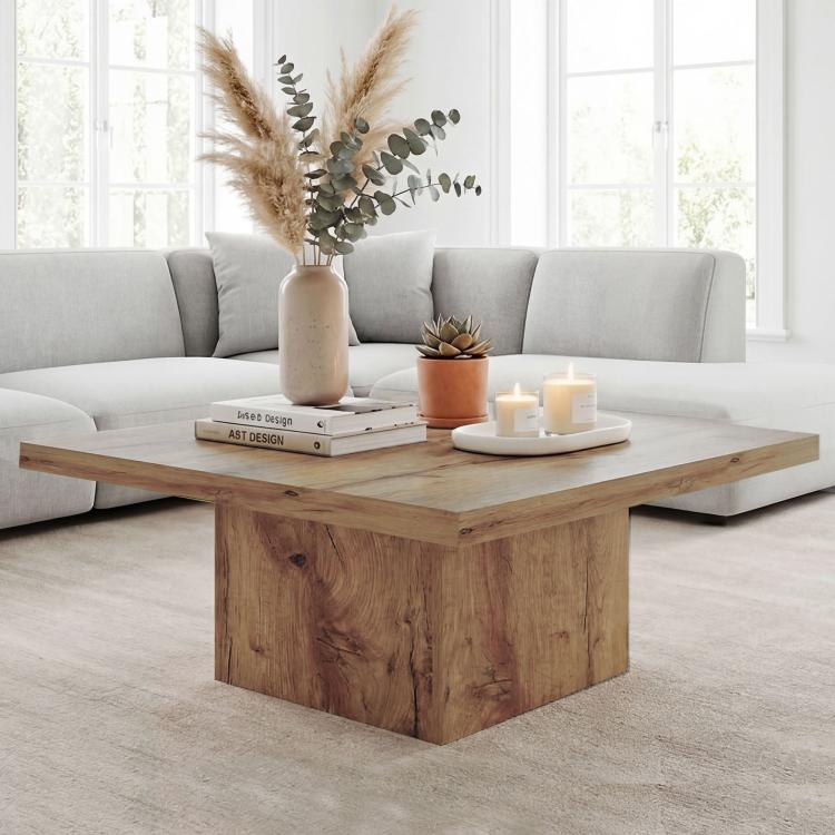 Light brown square wooden coffee table with thick tabletop and solid base