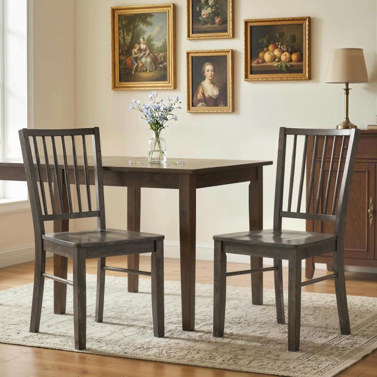 Charcoal gray armless dining chairs with tall vertical slat backrests and square wooden legs