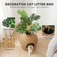 Decorative woven cat litter box enclosure with faux plant and round front doorway