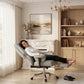 Light gray faux leather office chair with high back and reclining support