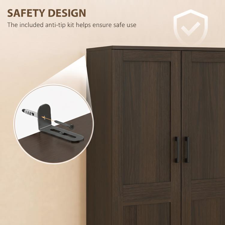 Brown cabinet with two doors and anti-tip hardware detail near metal handles