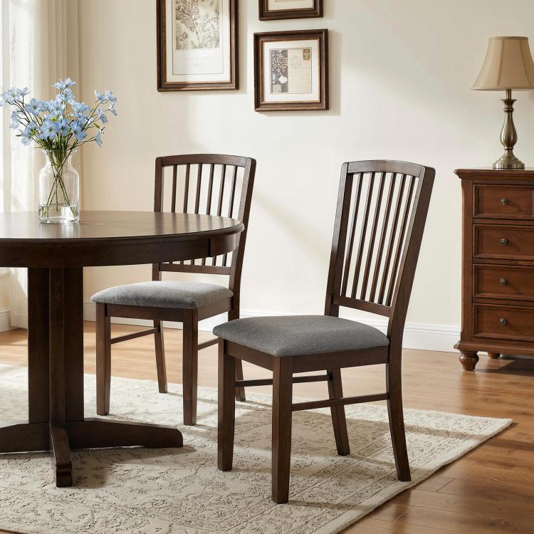 Two upholstered dining chairs with dark brown wooden frames and gray seat cushions