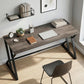 Industrial gray writing desk with black Z-shaped supports and spacious tabletop