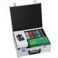 Poker chip set aluminum case open with stacked chips and card shuffler