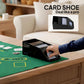 Black card shoe with stacked cards on a poker table