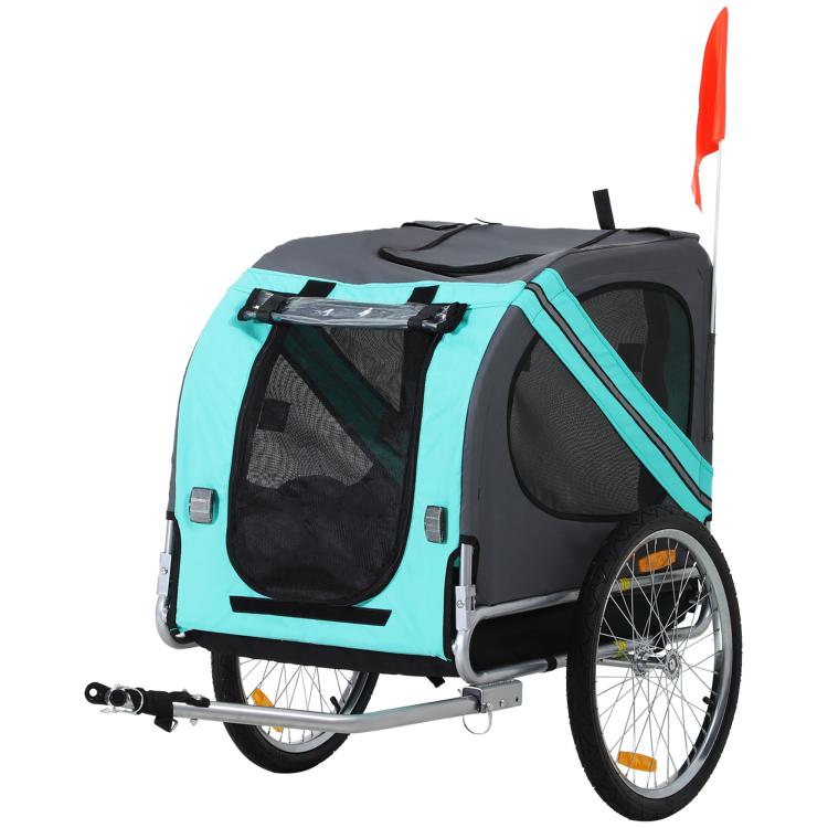 Green dog bike trailer with front and side mesh doors, large spoked wheels, safety flag