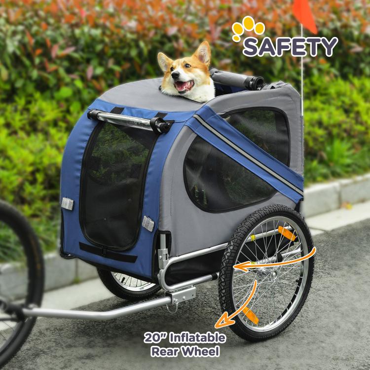 Blue and grey pet bike trailer with dog in window and rear inflatable wheel