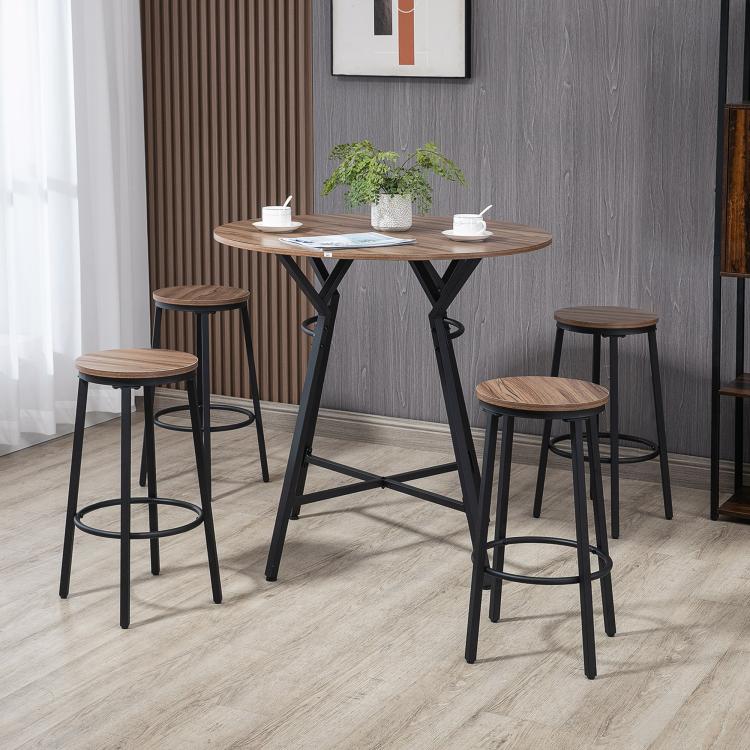 Round bar table and four stools for dining, black metal legs and wood-look seat tops.