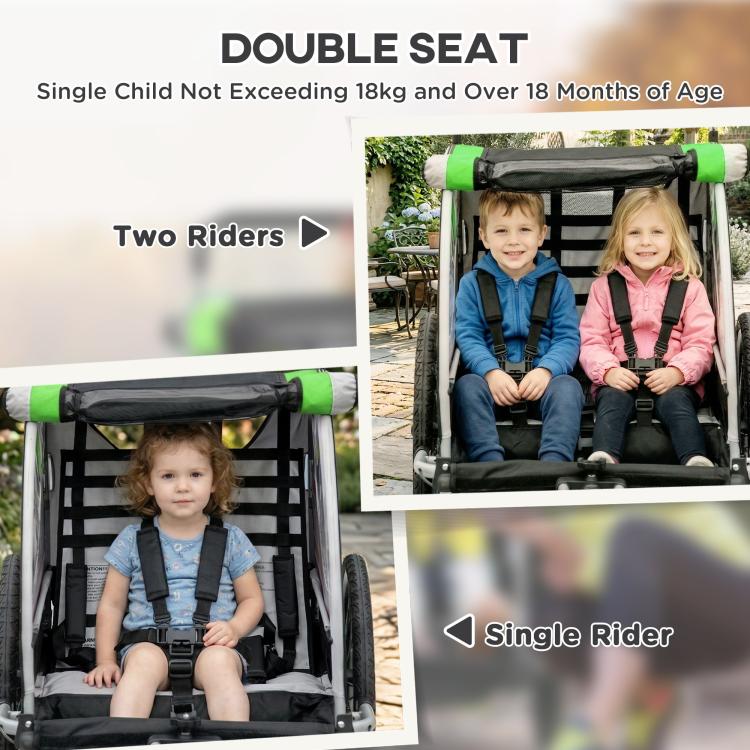 Green and black double-seat trailer with two children seated, padded harness straps